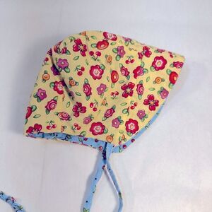 Bonnet. - Baby reversible blue and yellow flowers - see pic for sizing